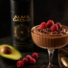 Cacao avocado mousse with raspberries next to the Alma Cacao tin
