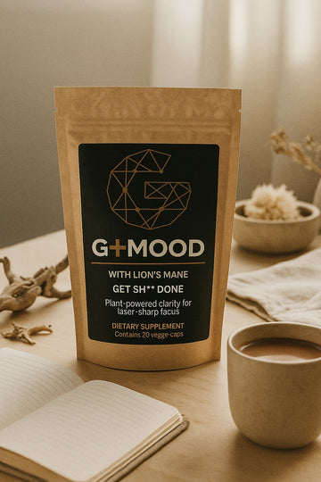 G+MOOD pouch on a desk with a notebook and a warm drink