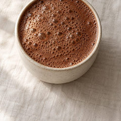 A frothy cup of ceremonial cacao from above