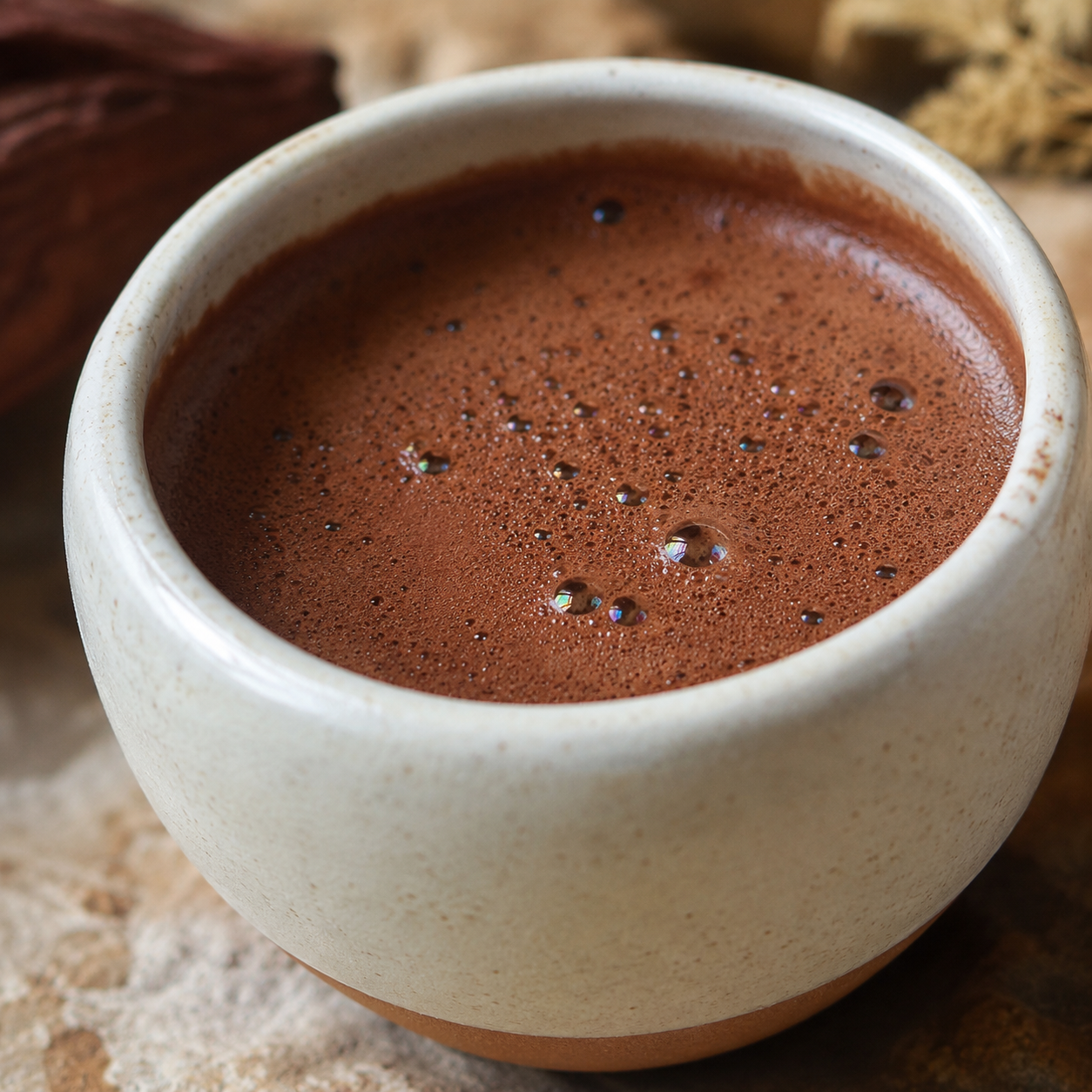 Thick ceremonial cacao in a ceramic cup, close up